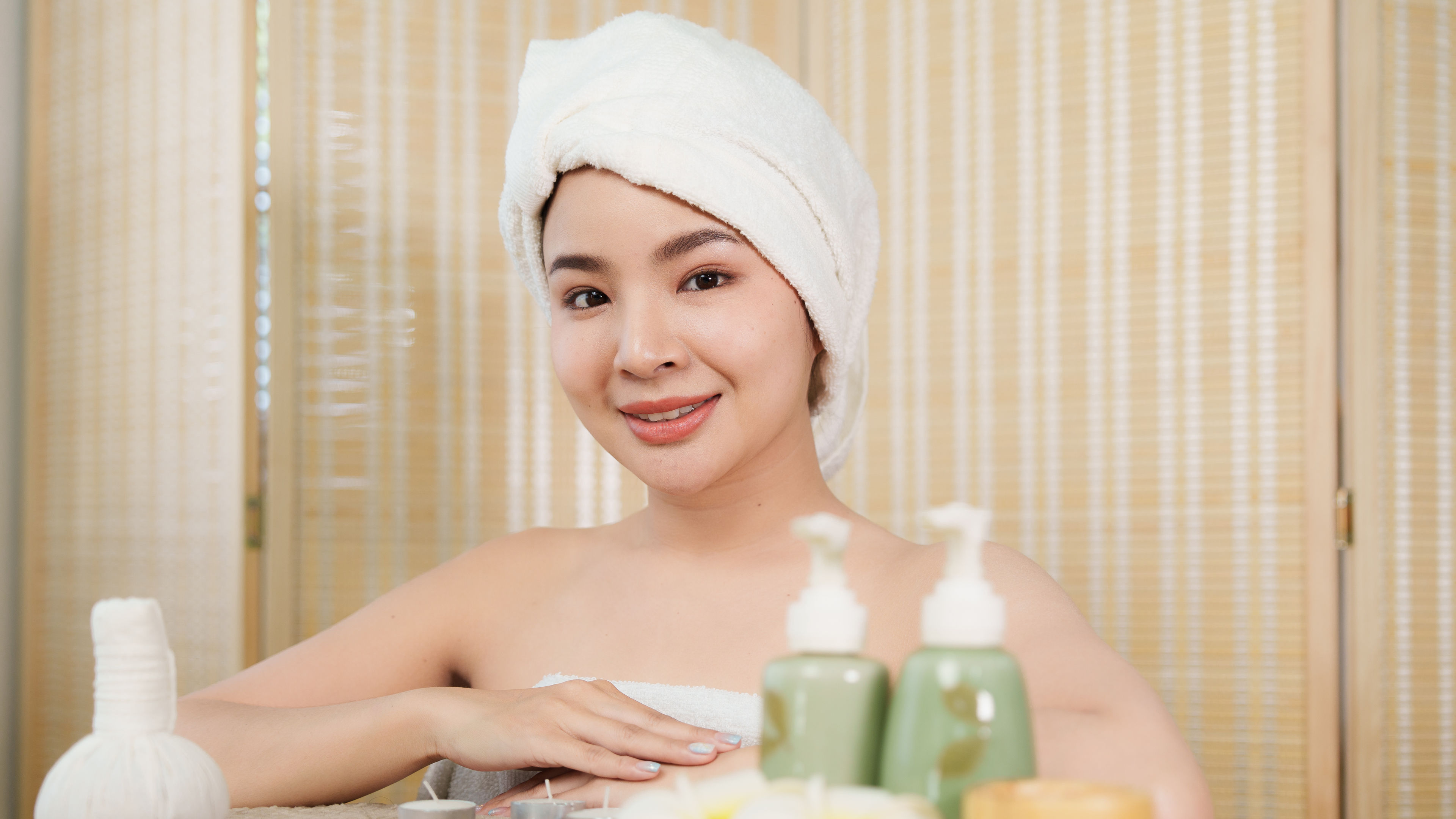 Young woman with natural cosmetic products