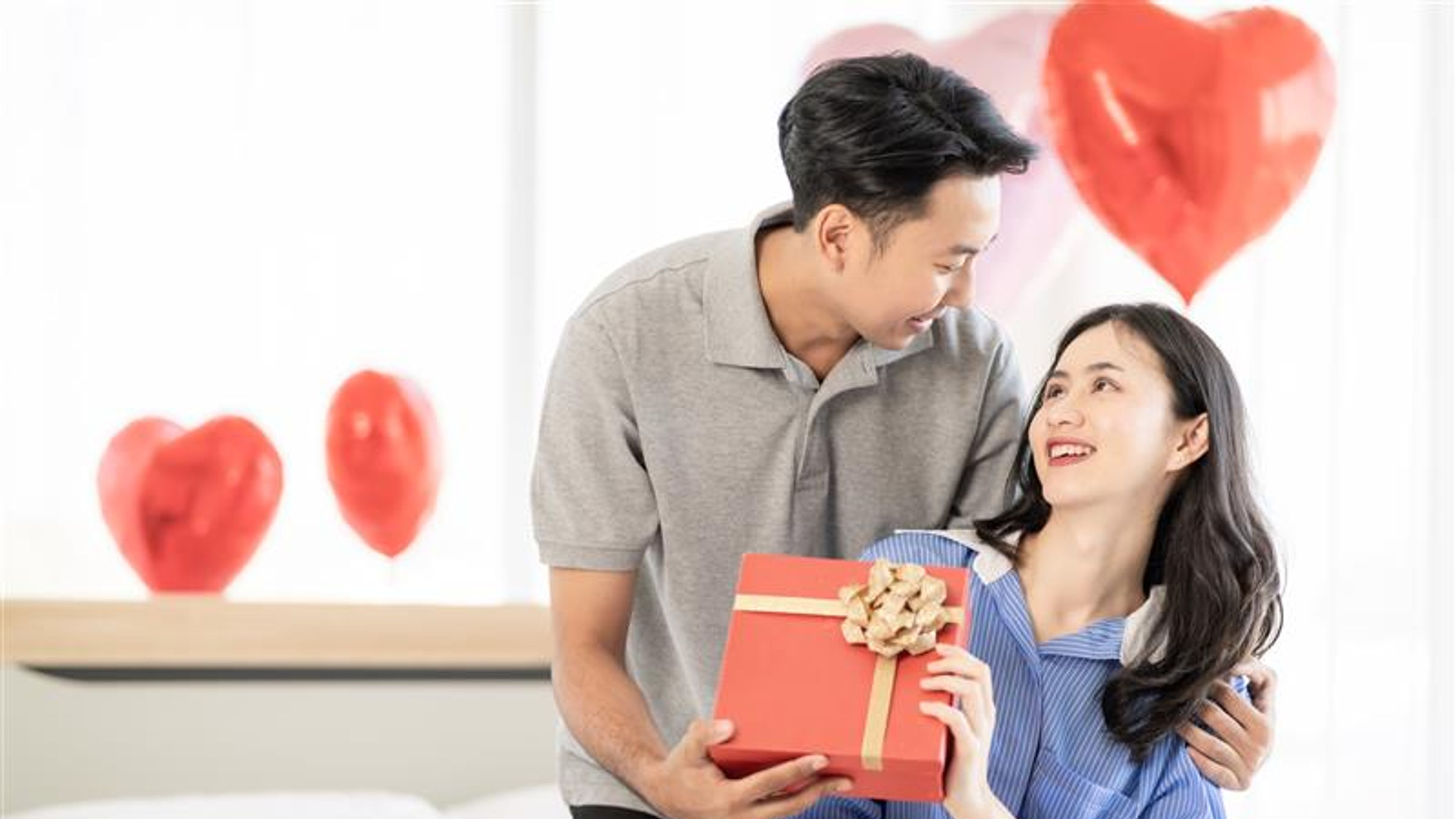 A happy couple sharing valentine’s day gift