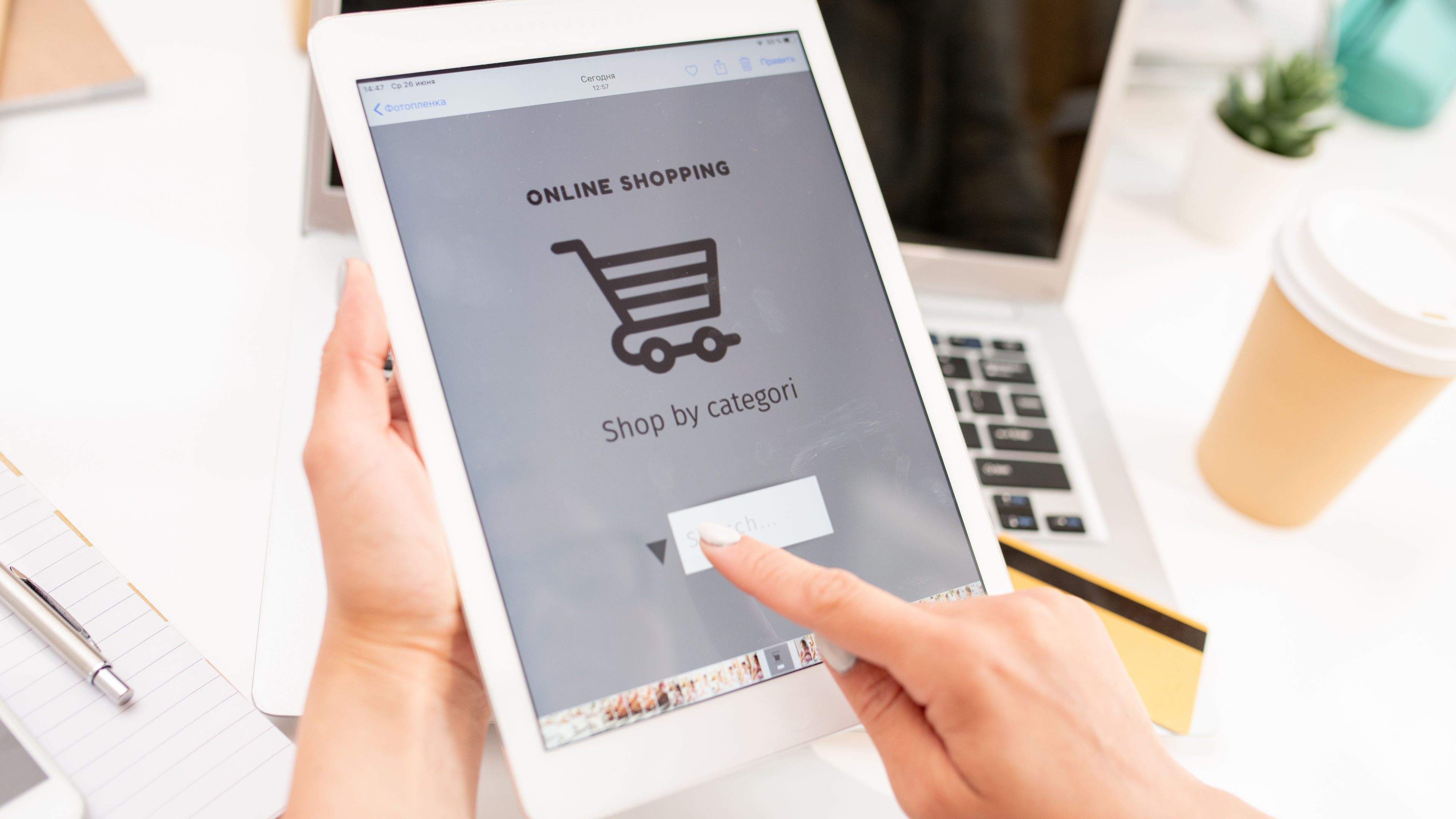 A person is using a tablet to browse an online shopping website 