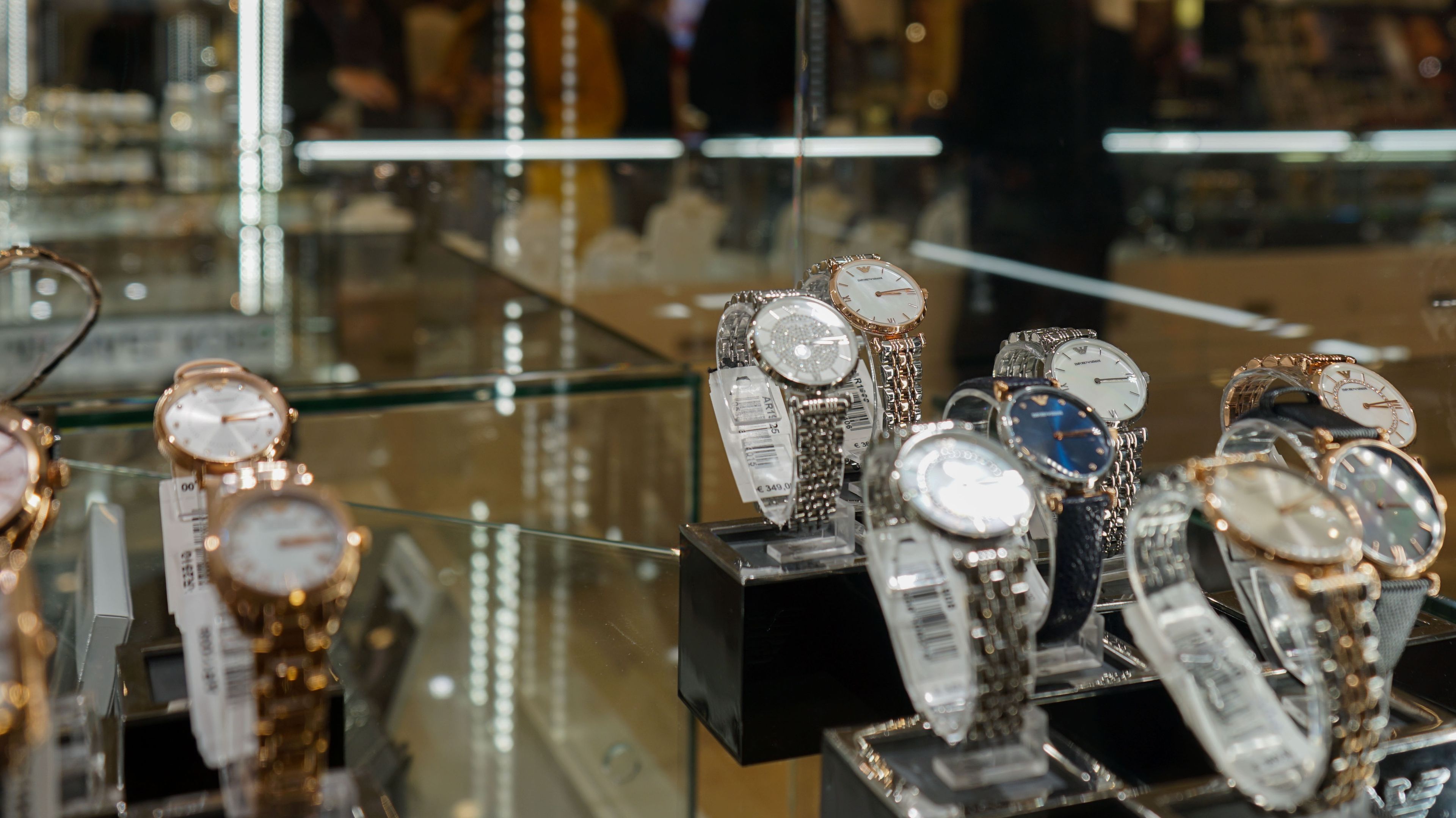 A glass case filled with a dazzling collection of timepieces 