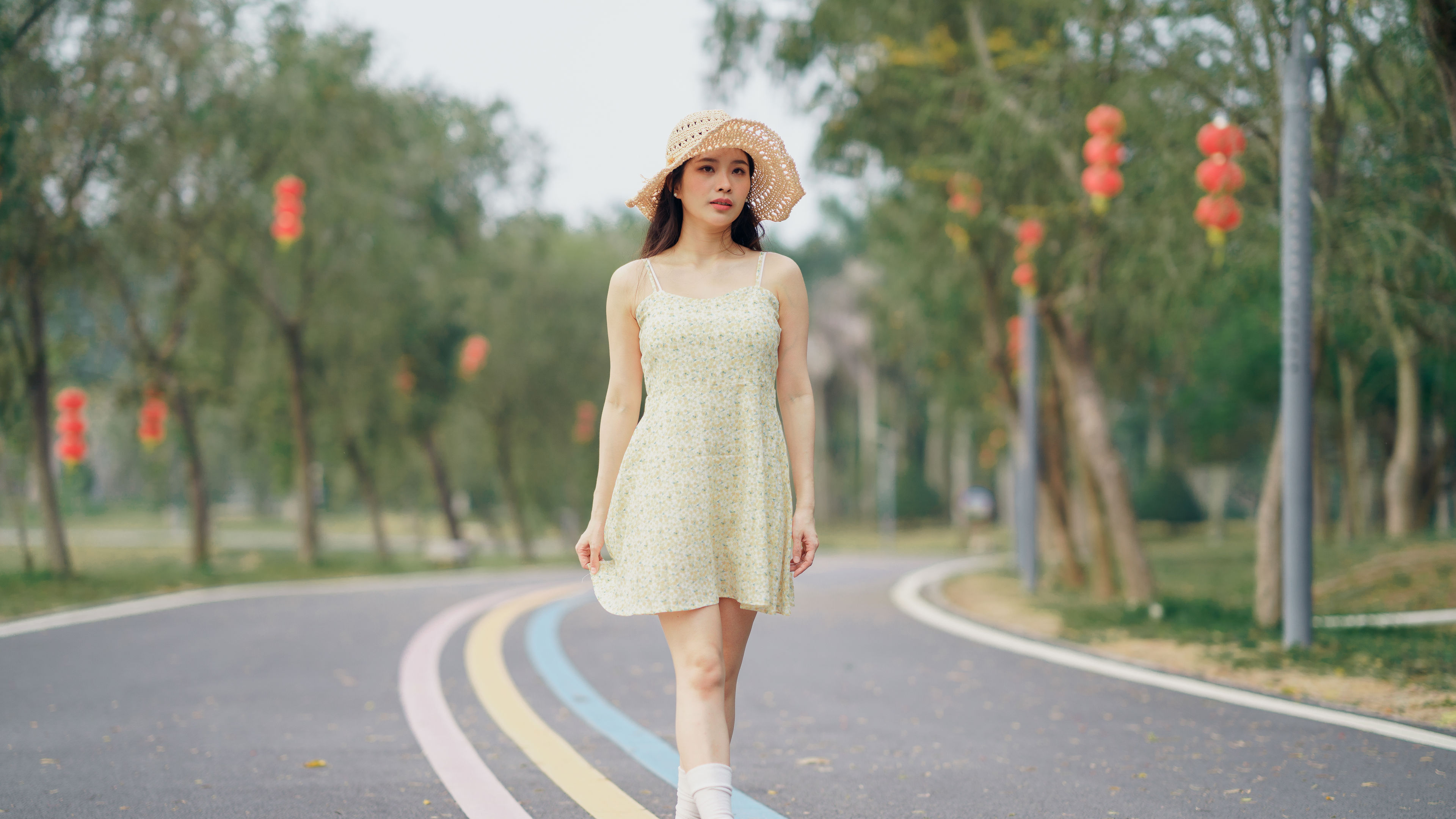 A picture-perfect moment, her floral dress and hat exuding classic elegance. 