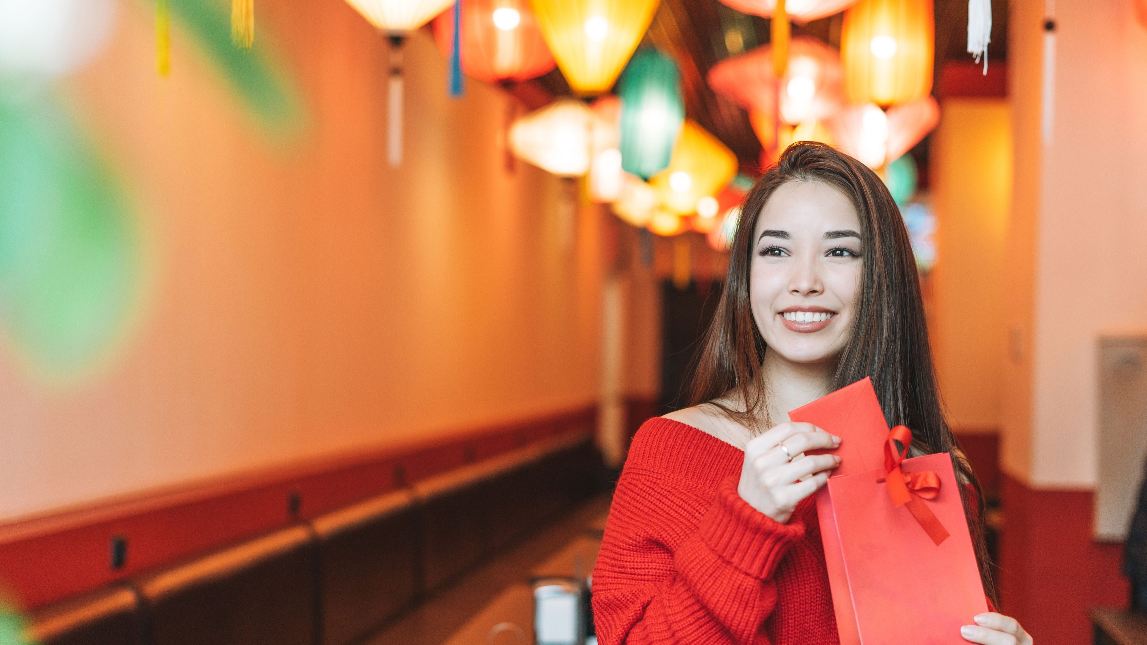 A happy woman holding a special gift 