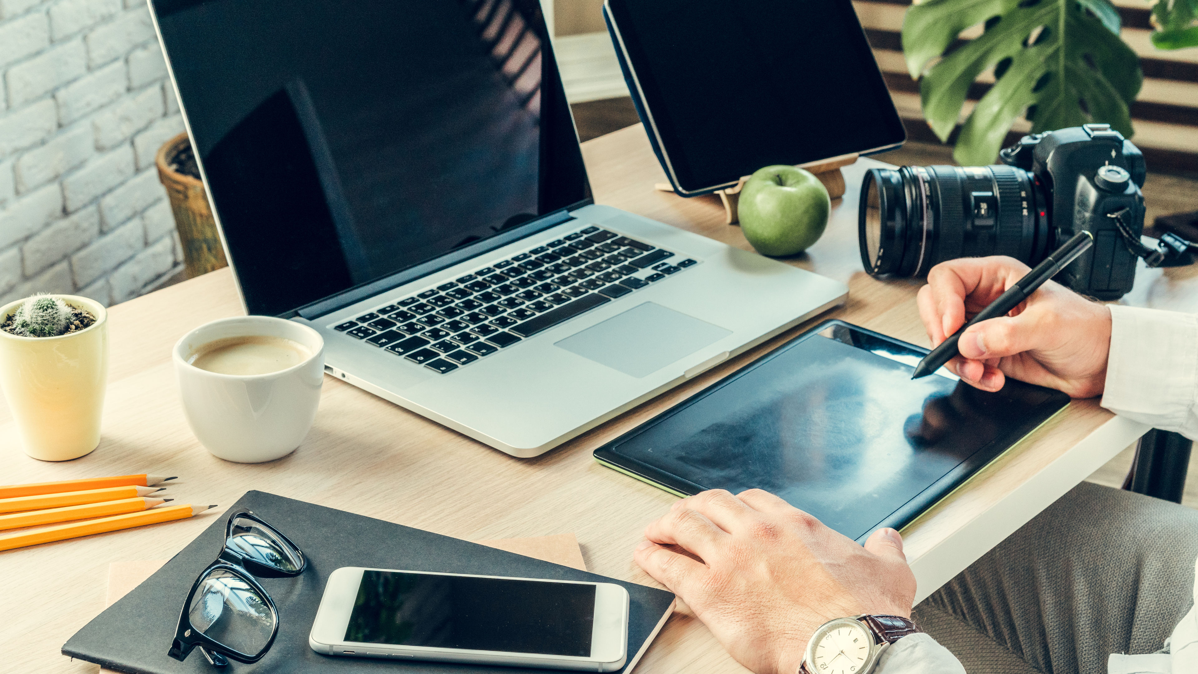 A working table with some tech devices