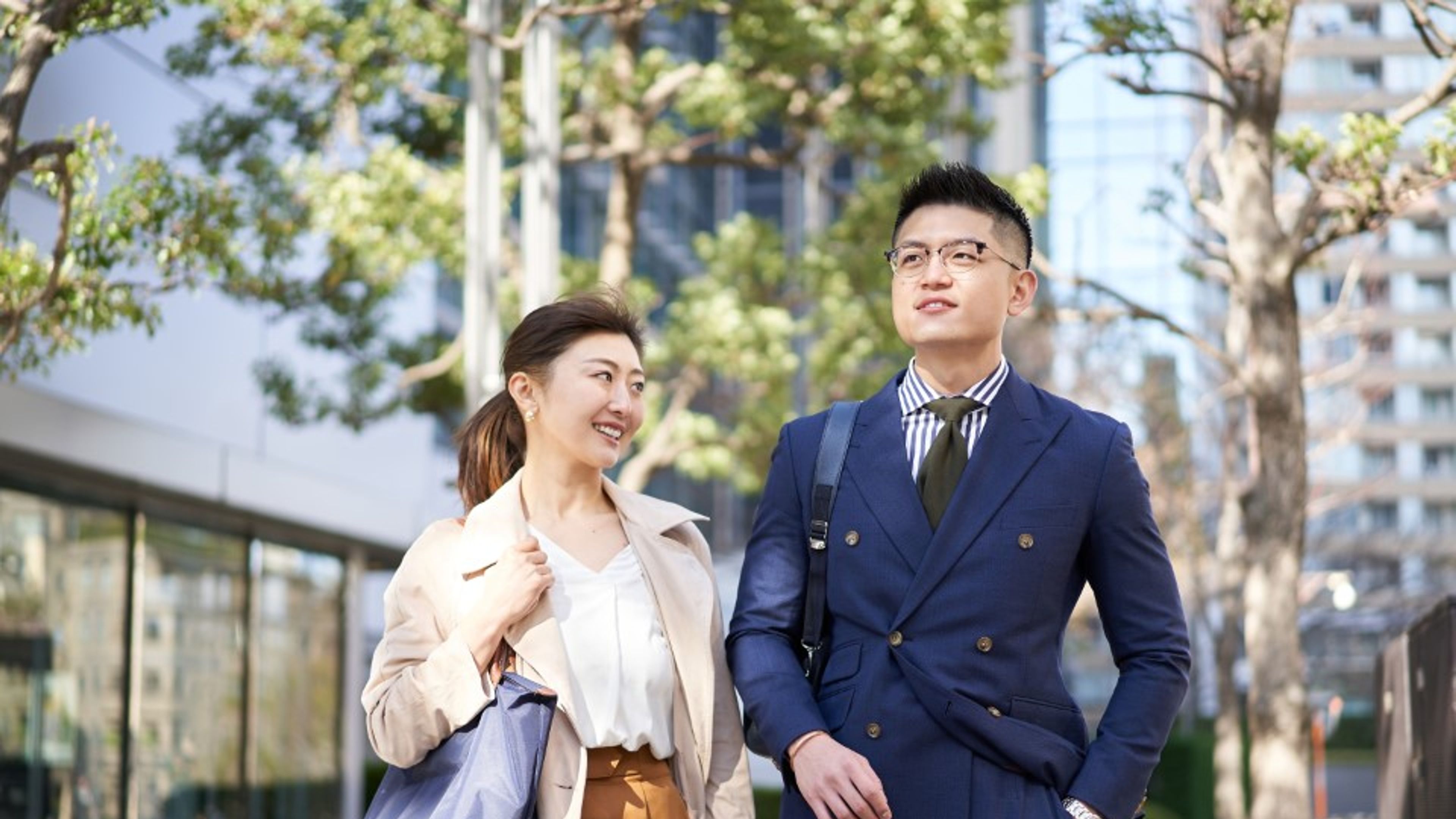 Asian businessperson walking in the business district