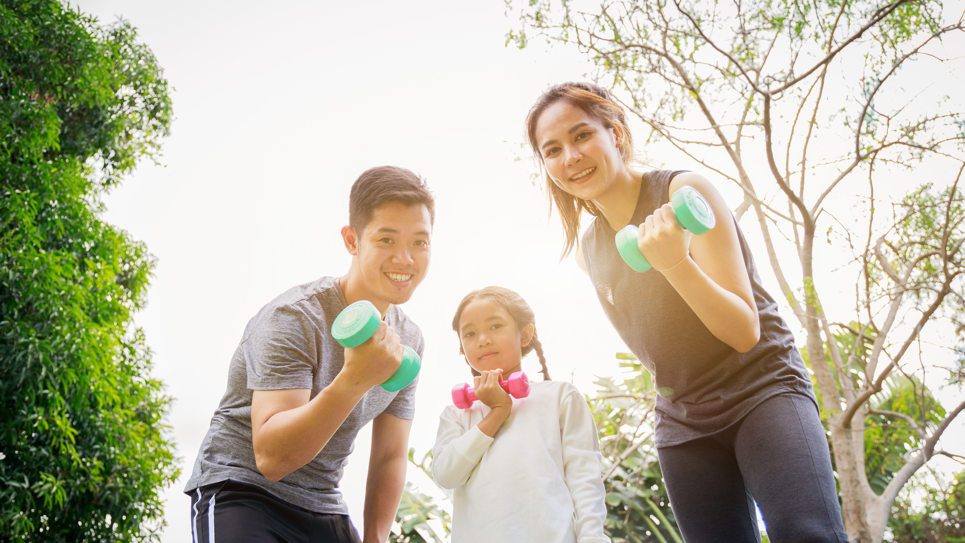 Image of asian family exercising 