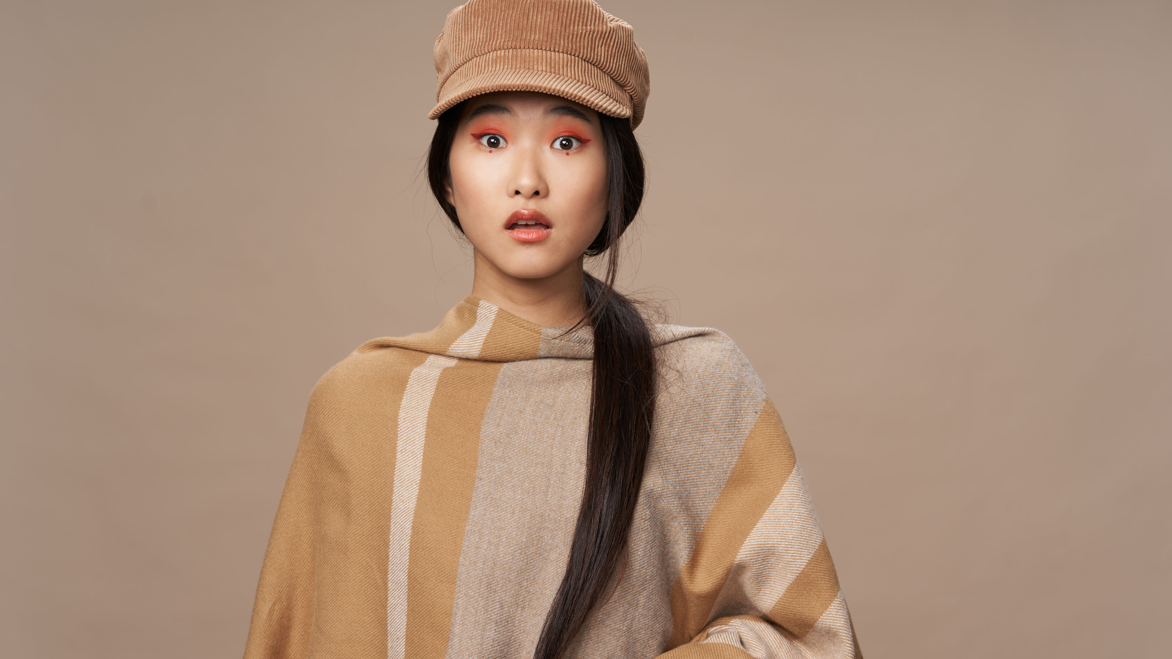 An Asian-inspired look with vibrant makeup and graceful style