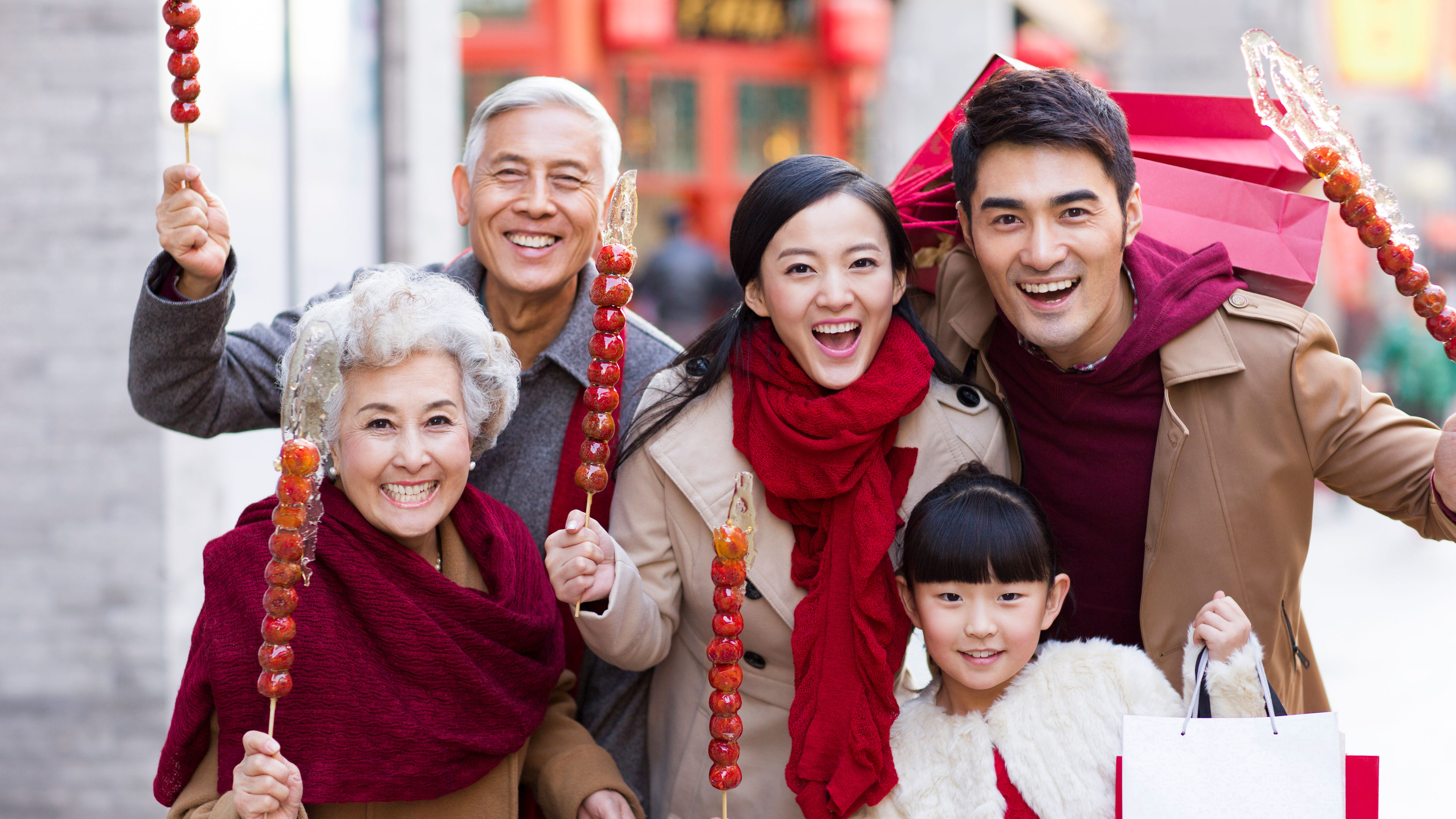 Family with candied berries celebrating 