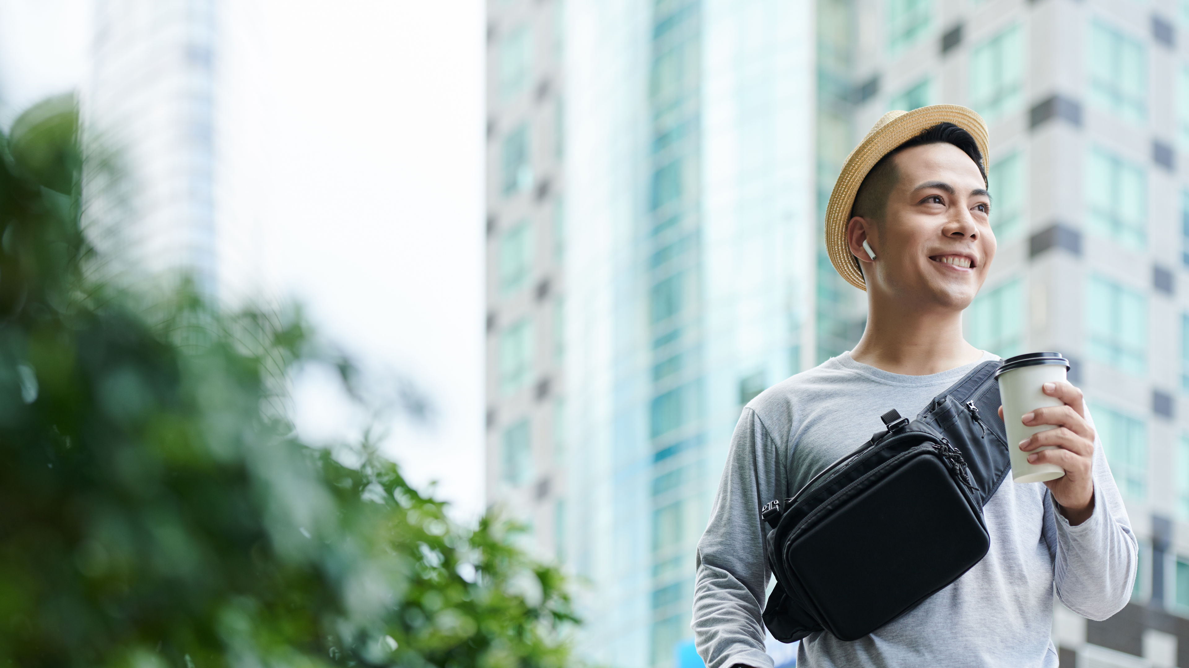 Cheerful Tourist Walking with Takeout Coffee 