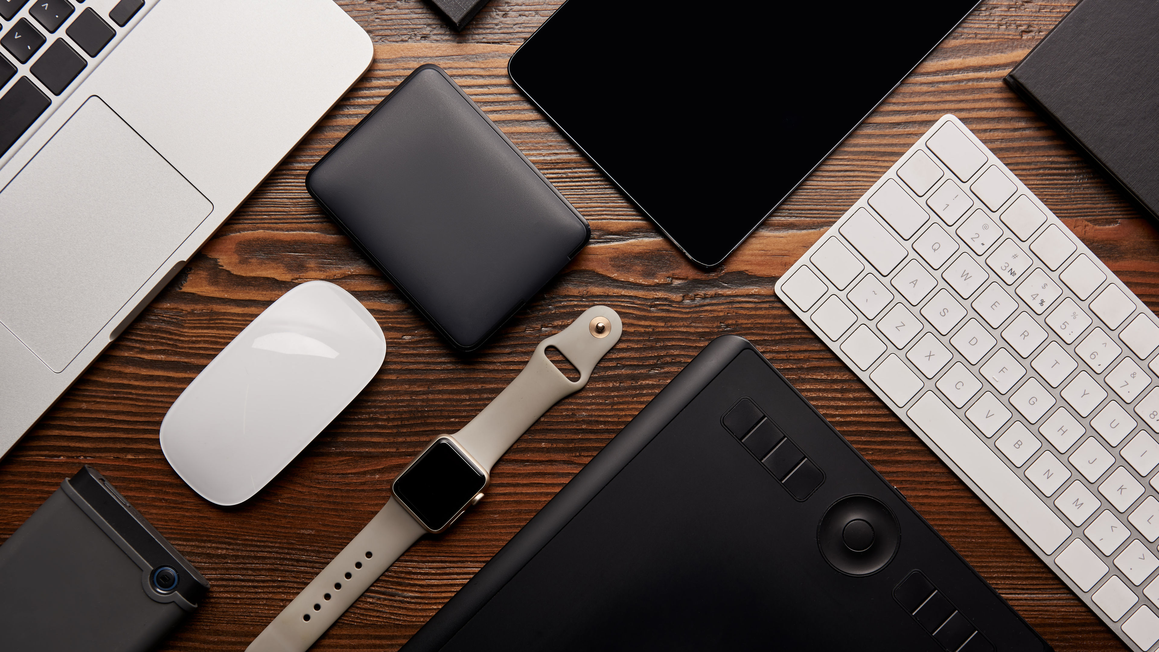 Flat lay with different devices on wooden workplace 