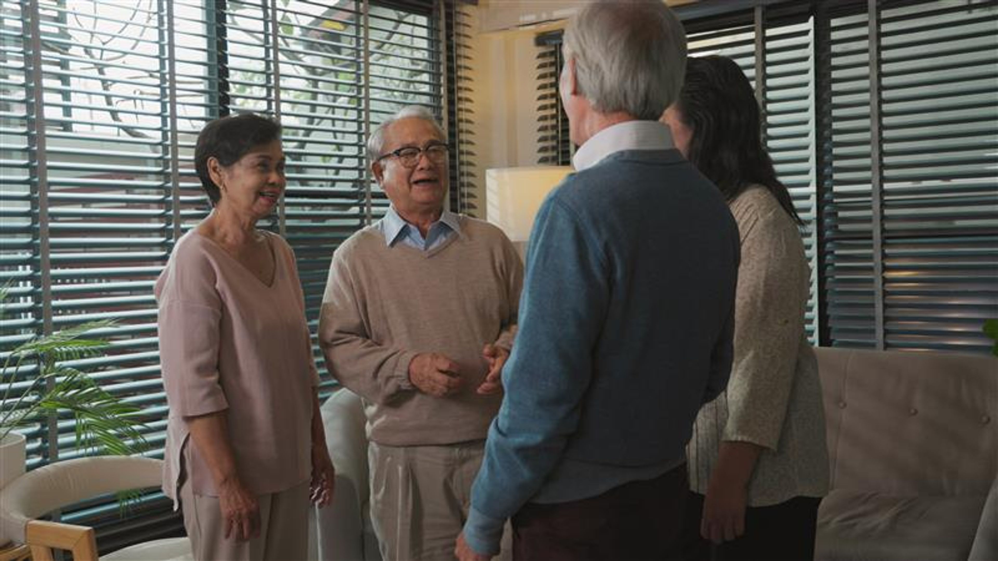 Group elderly having fun, talking, smiling at home 

 