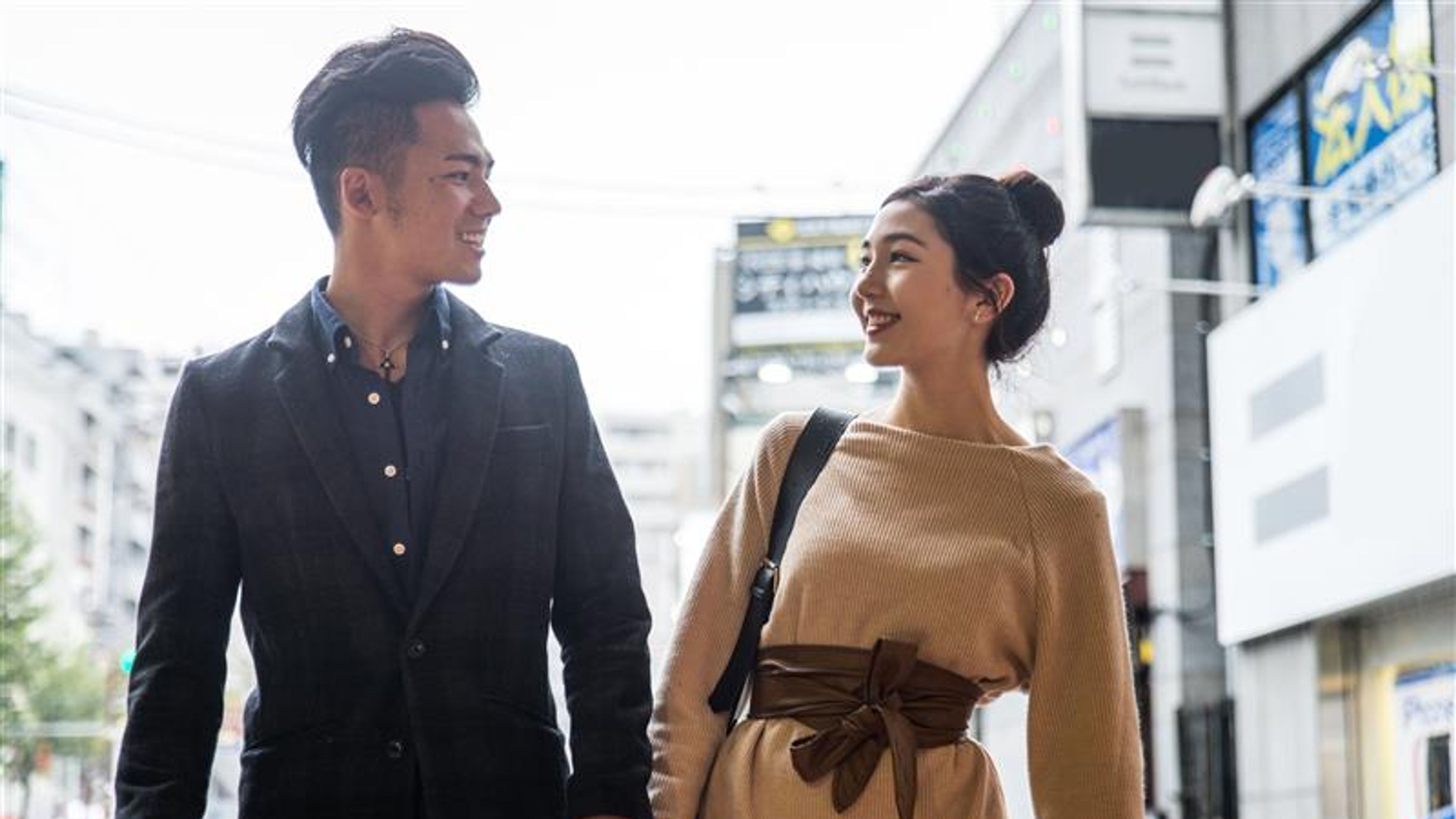 Happy japanese couple dating outdoors in Tokyo