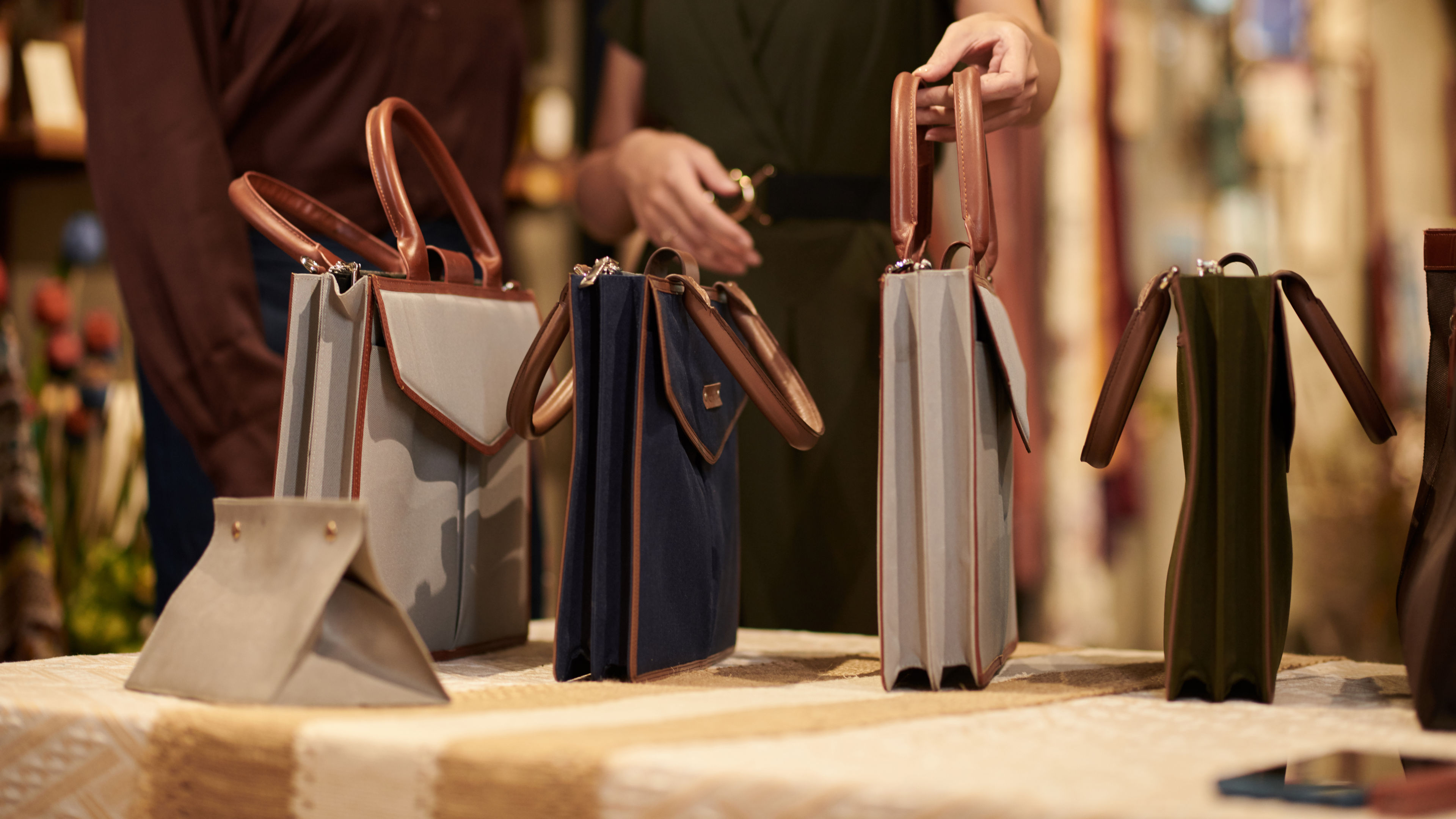 A collection of luxury bags on a table 