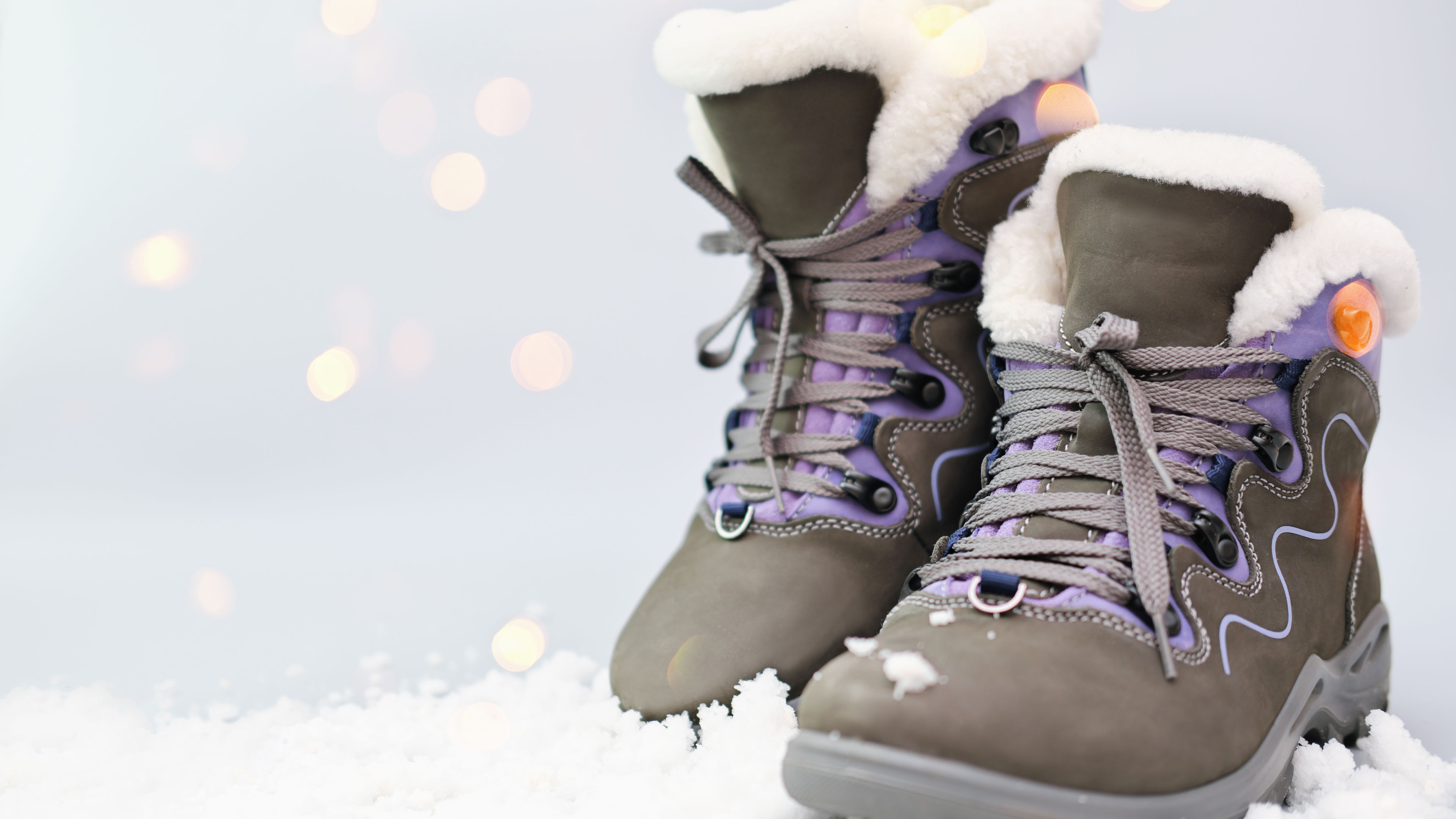 Stylish winter boots in the snow. 
