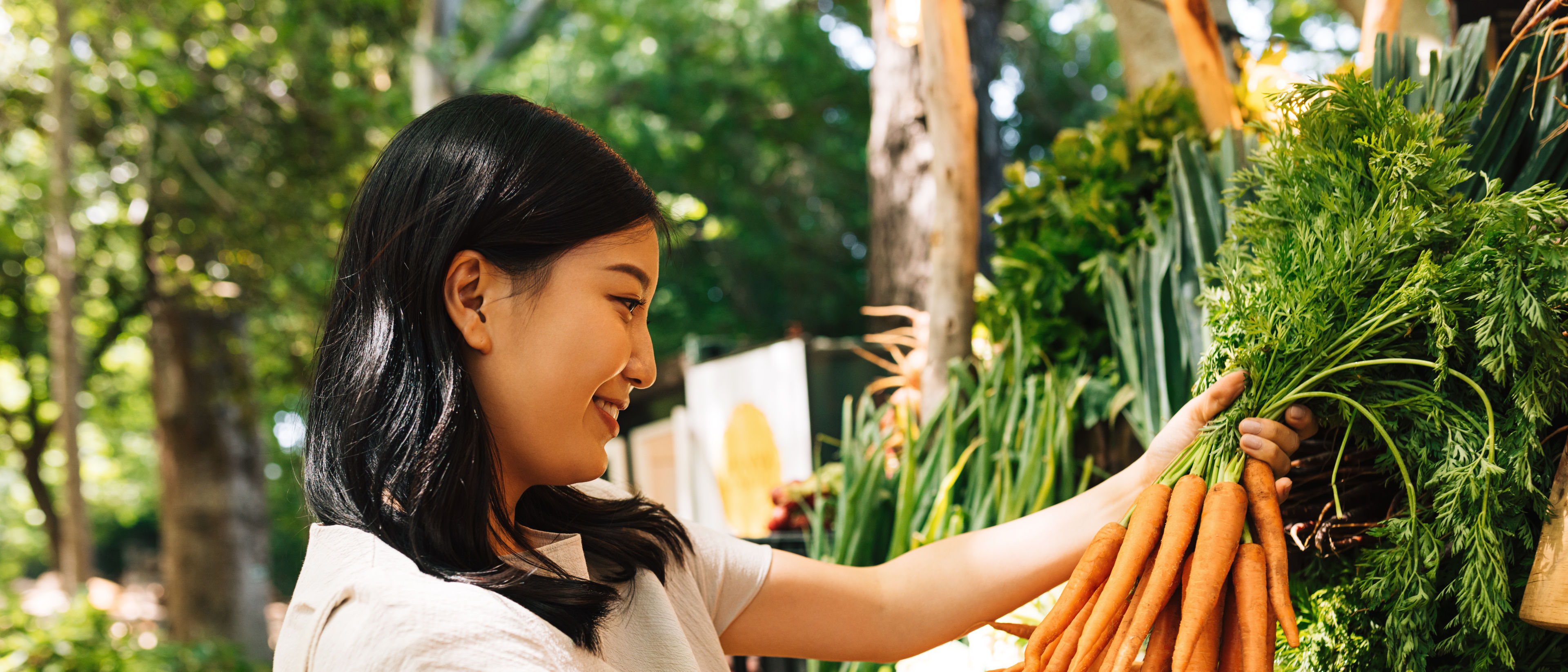 Woman buying carrot