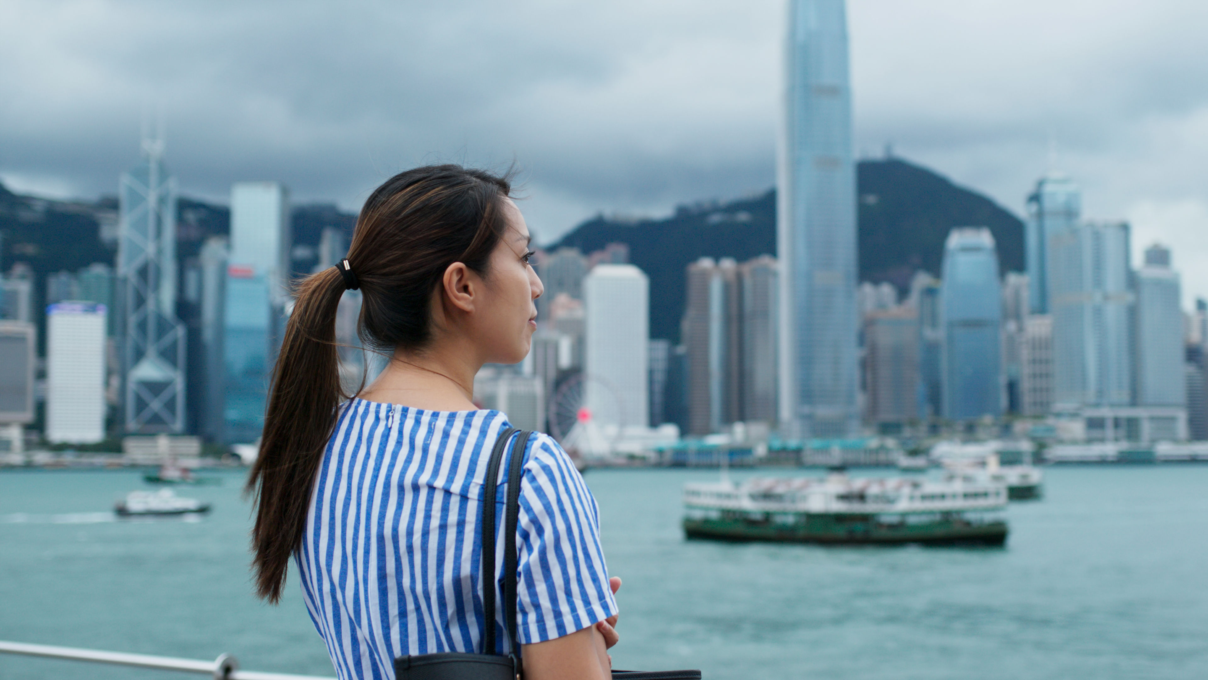 Woman look at the city view in Hong Kong 