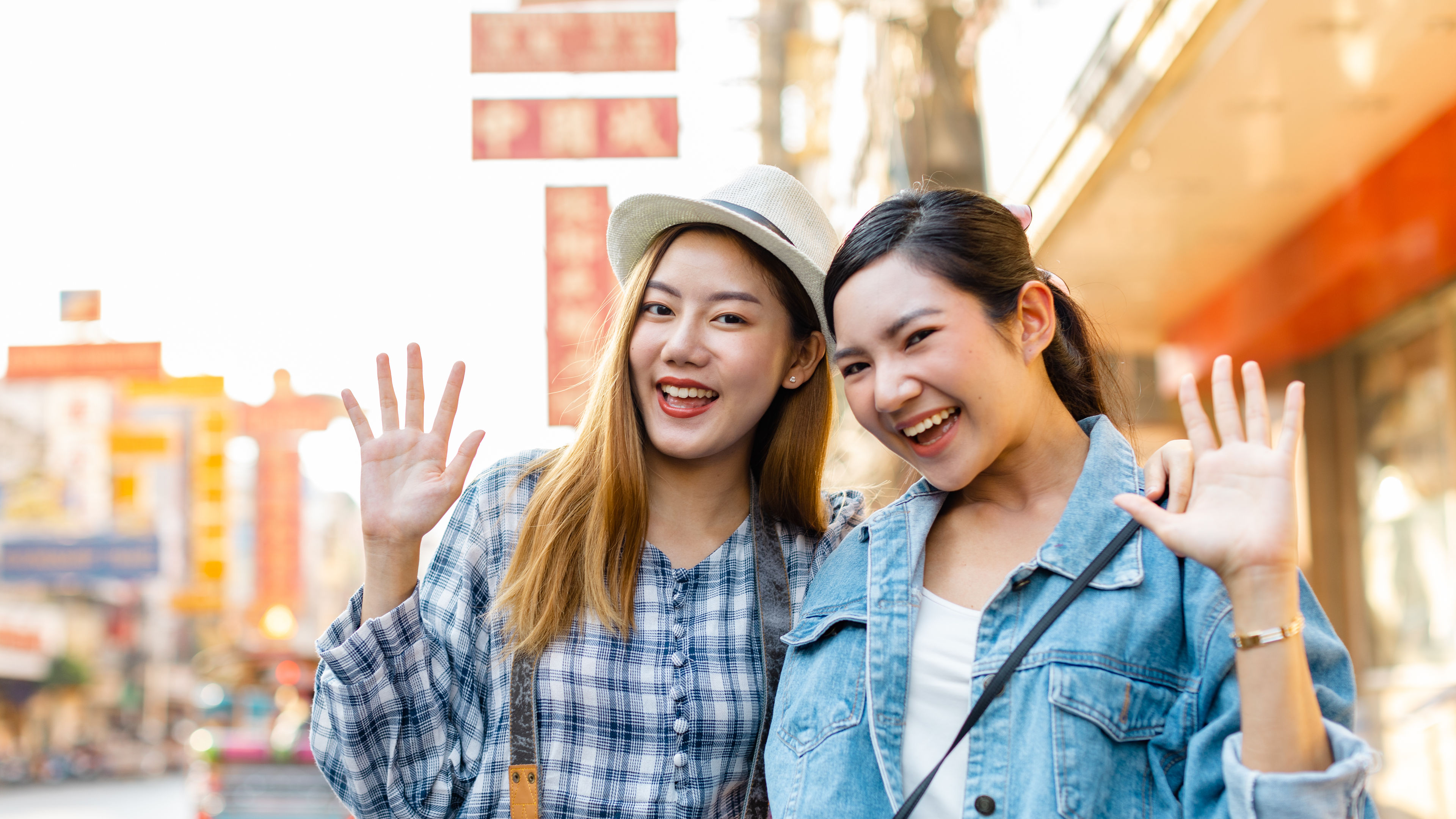 Young Asian travellers enjoy city life, street food, and fun moments on their journey.