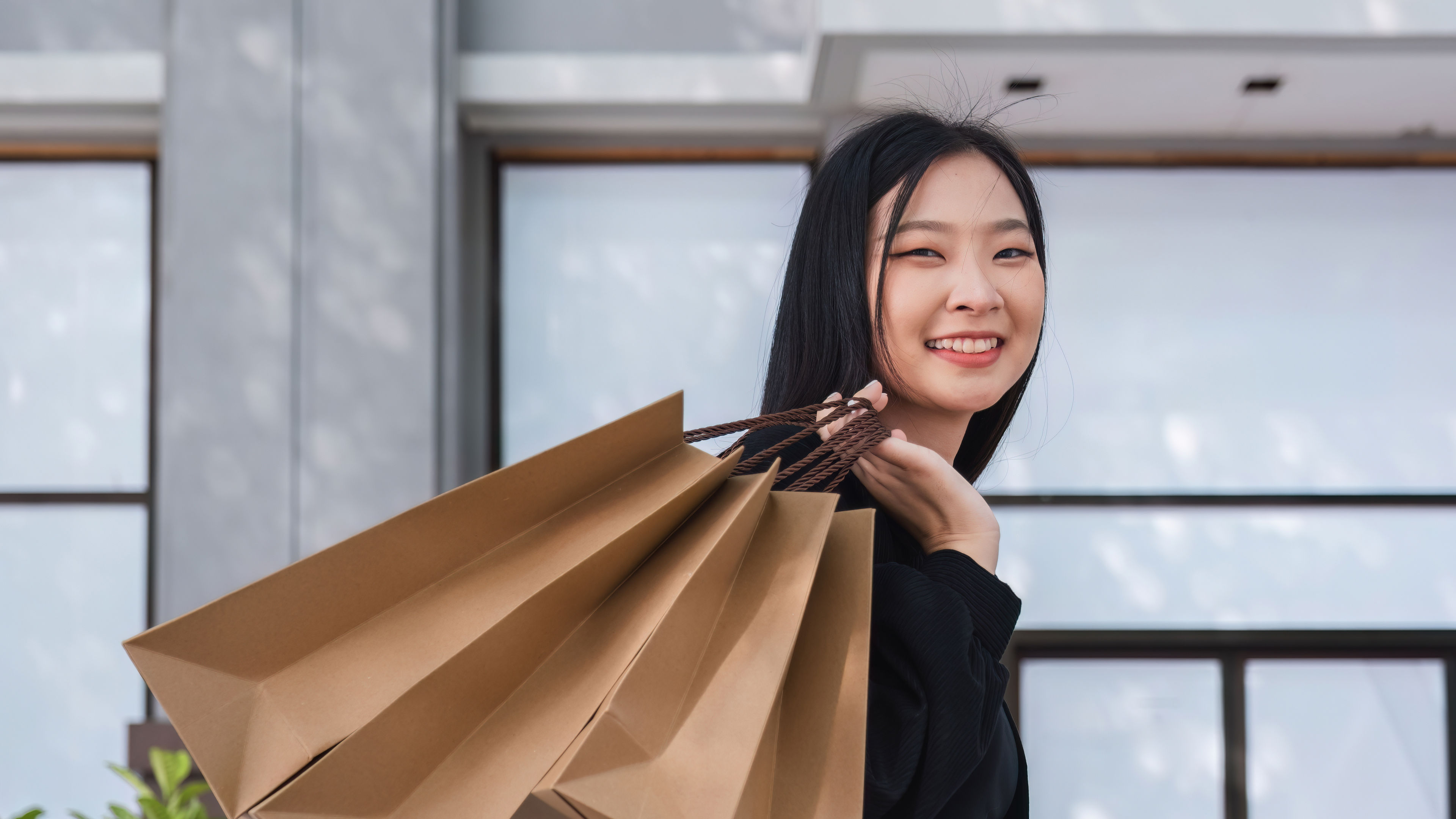 Image of an asian woman with bags 