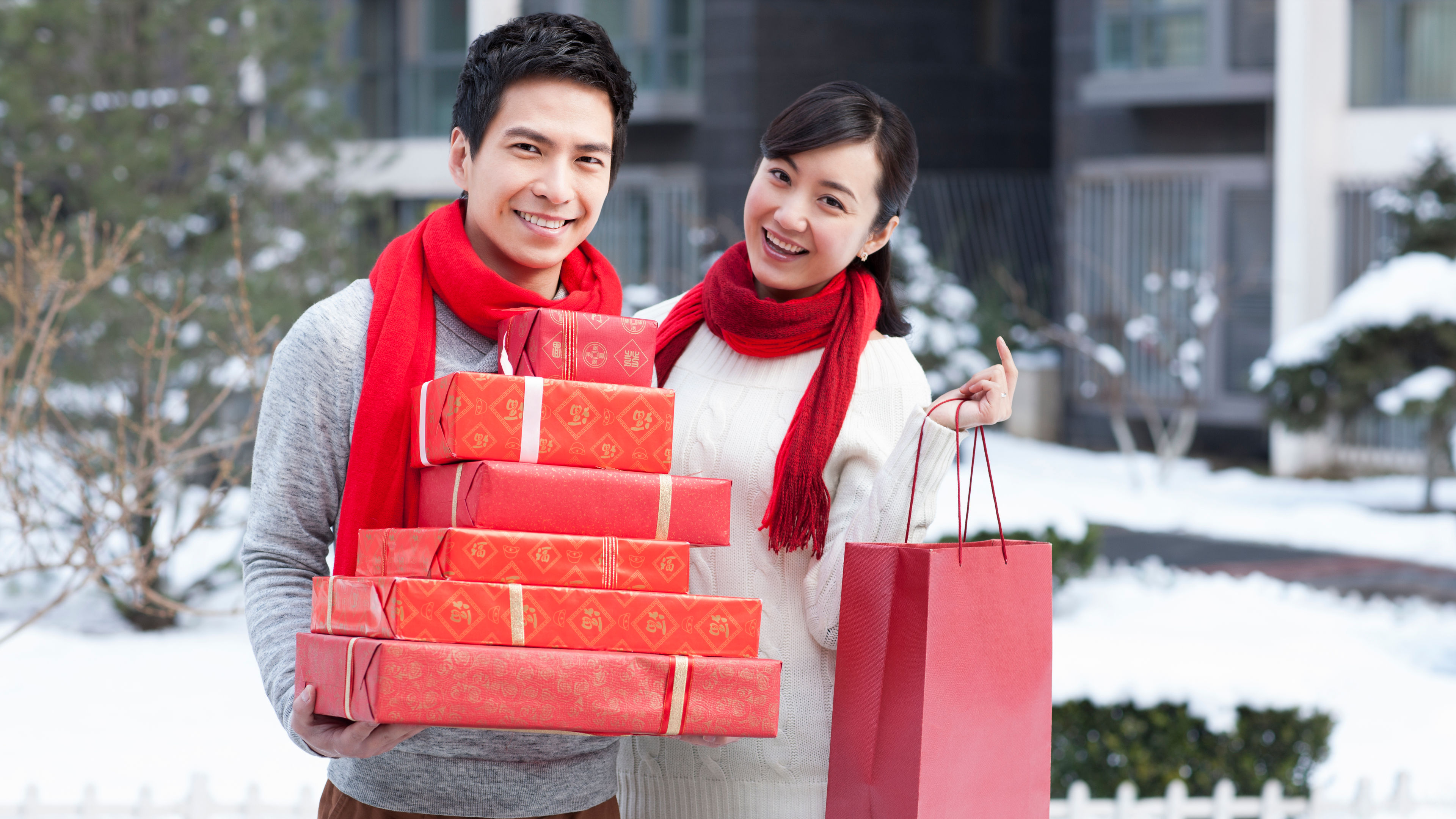 Image of Young couple with gifts 