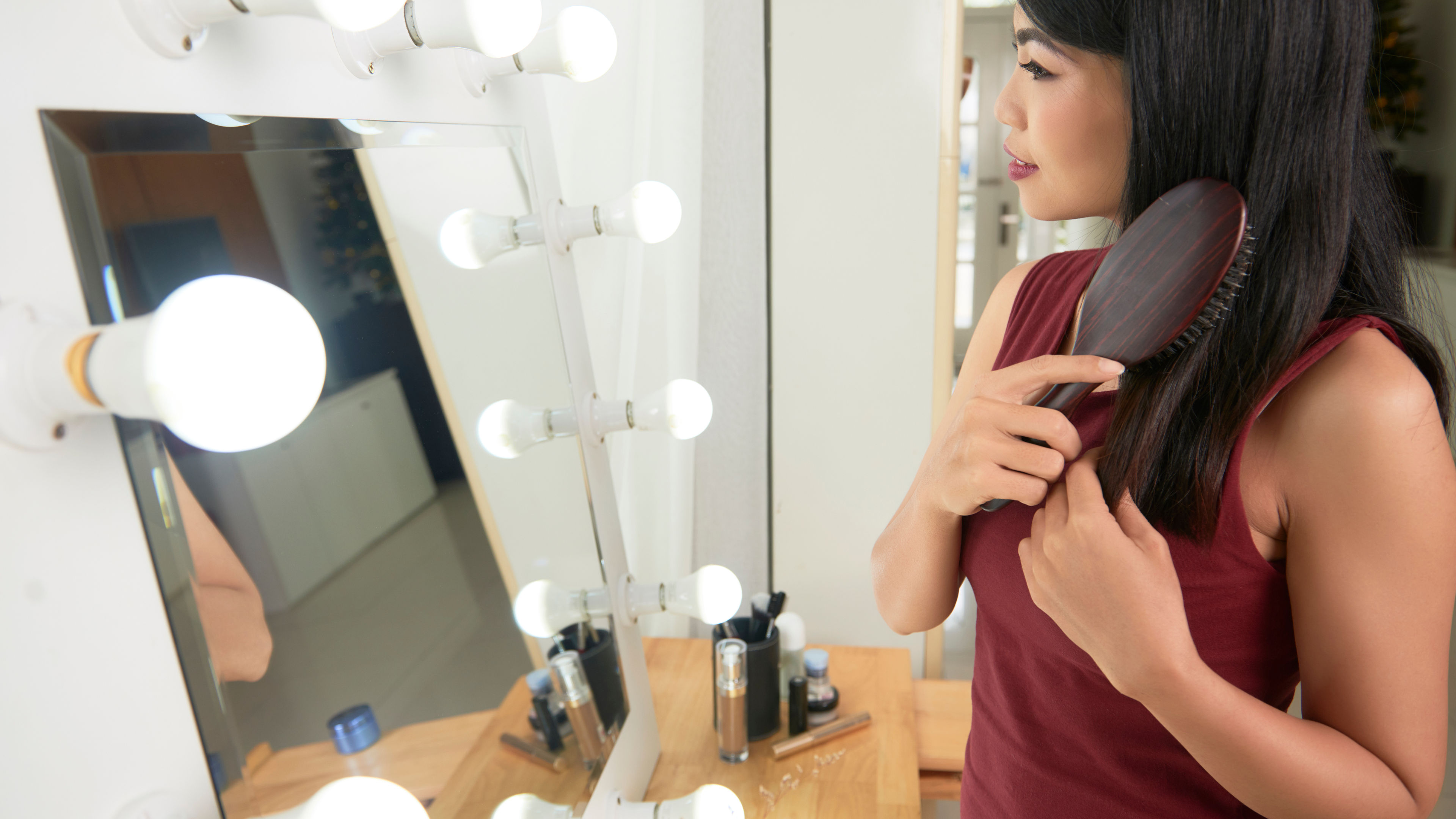 A young woman getting ready to go out 